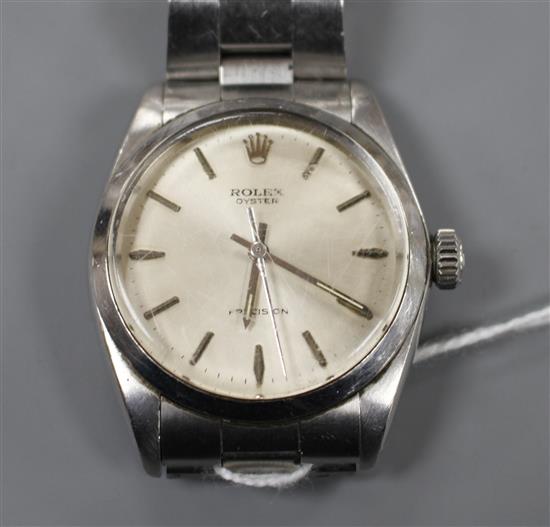 A gentlemans stainless steel Rolex Oyster precision manual wind wrist watch, on a stainless steel Rolex bracelet, serial no.1667922